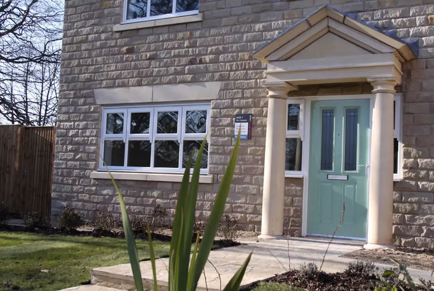 a photo of a green composite door fitted in London